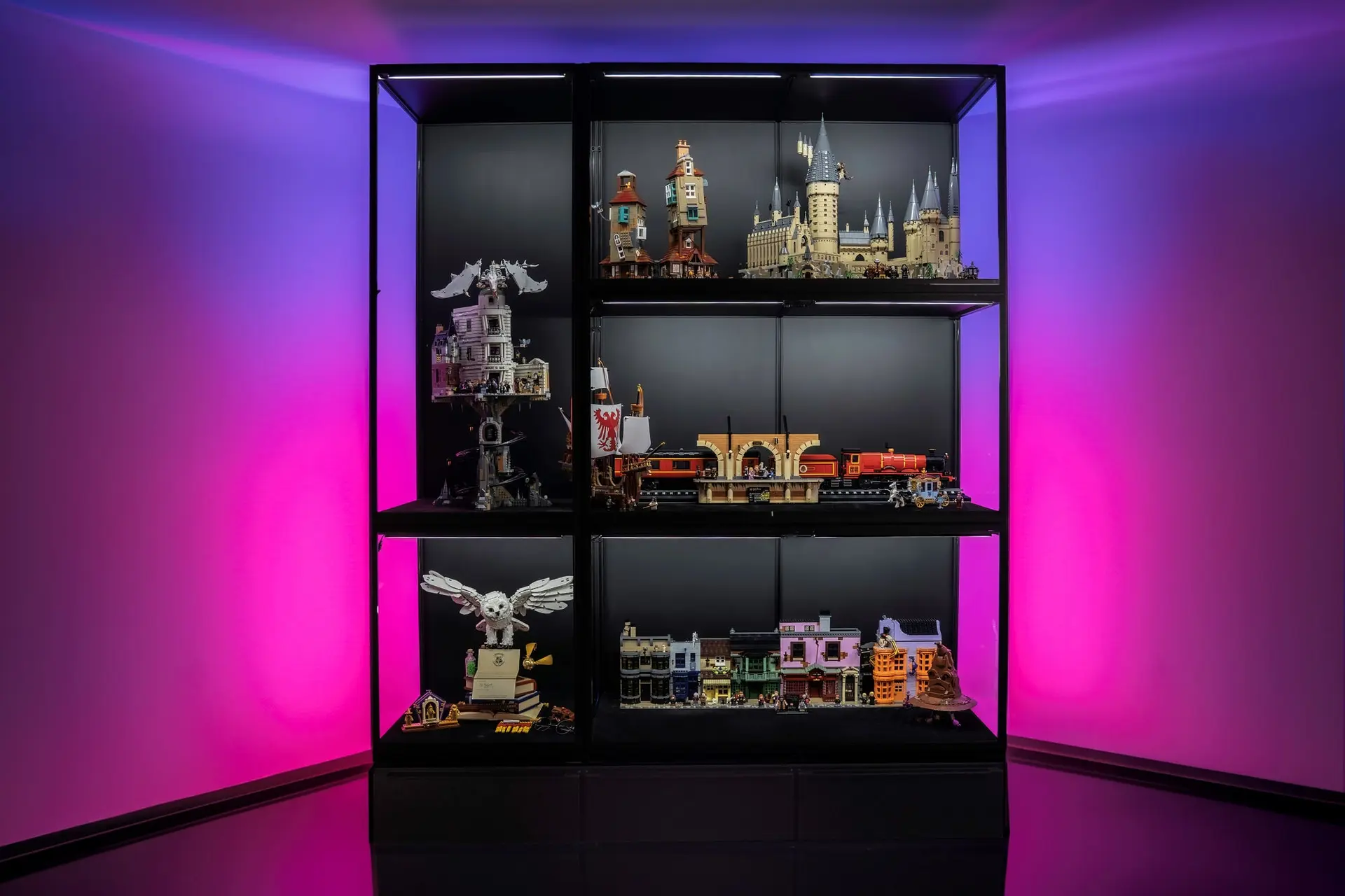 LEGO Harry Potter sets displayed in lit Moducase display cases