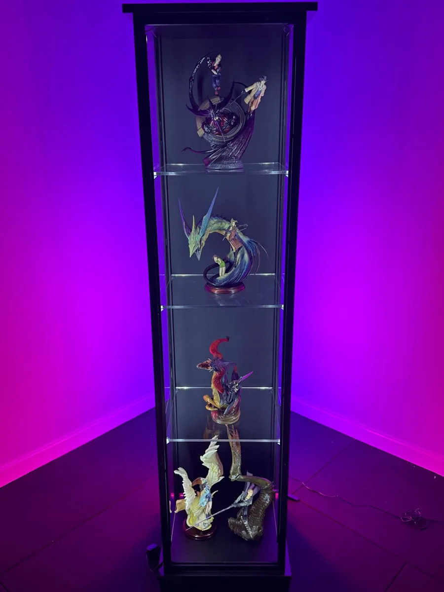 Moducase Mono display case lit in purple, showing Final Fantasy statues on glass shelves